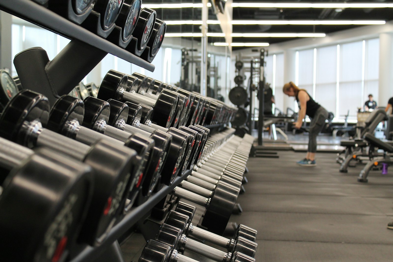 Racks of dumbbells along the training floor